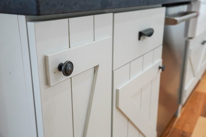 Barn-wood style cabinet doors made with painted Maple hardwood.