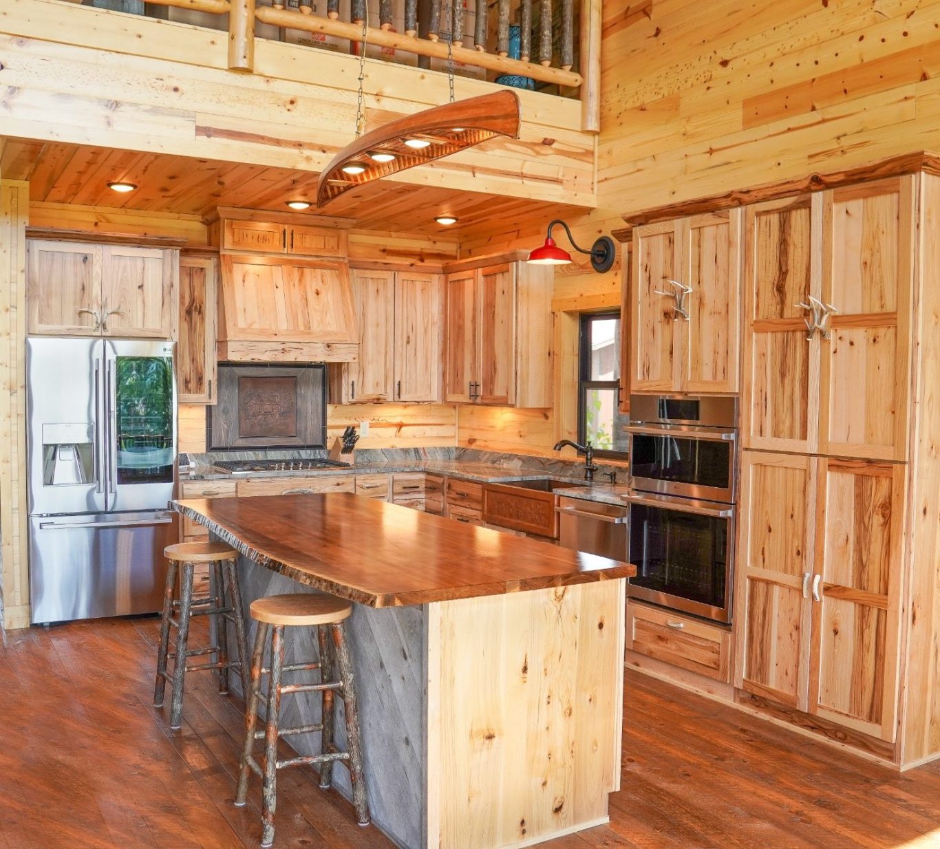 Popular custom rustic hickory kitchen with a wooden slab island.