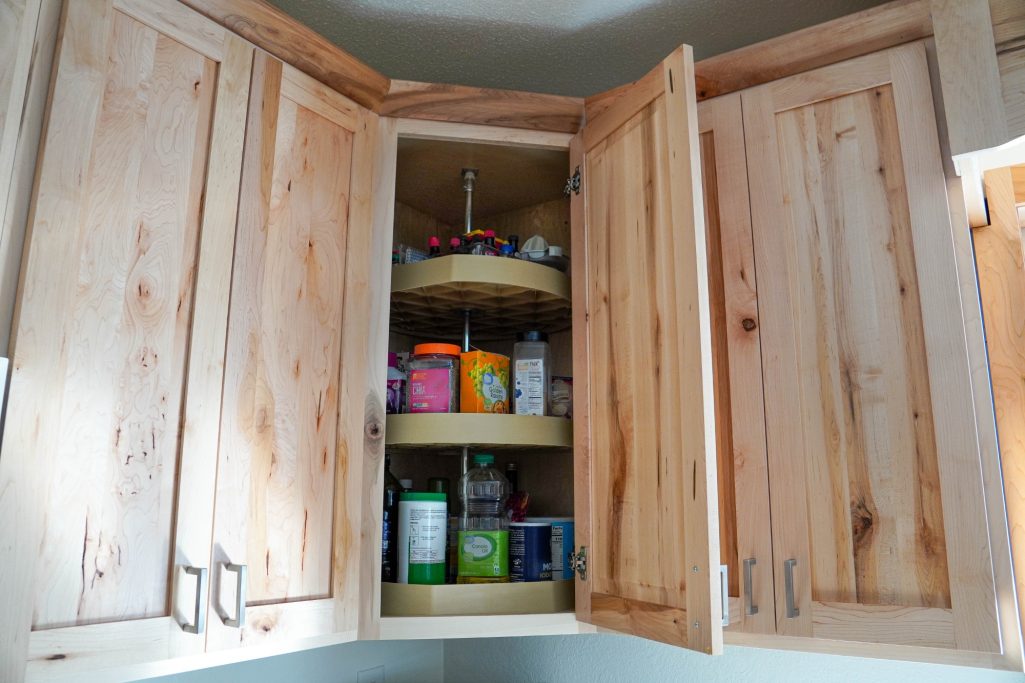 Tiered custom built Lazy Susan corner cabinet built by Amish.