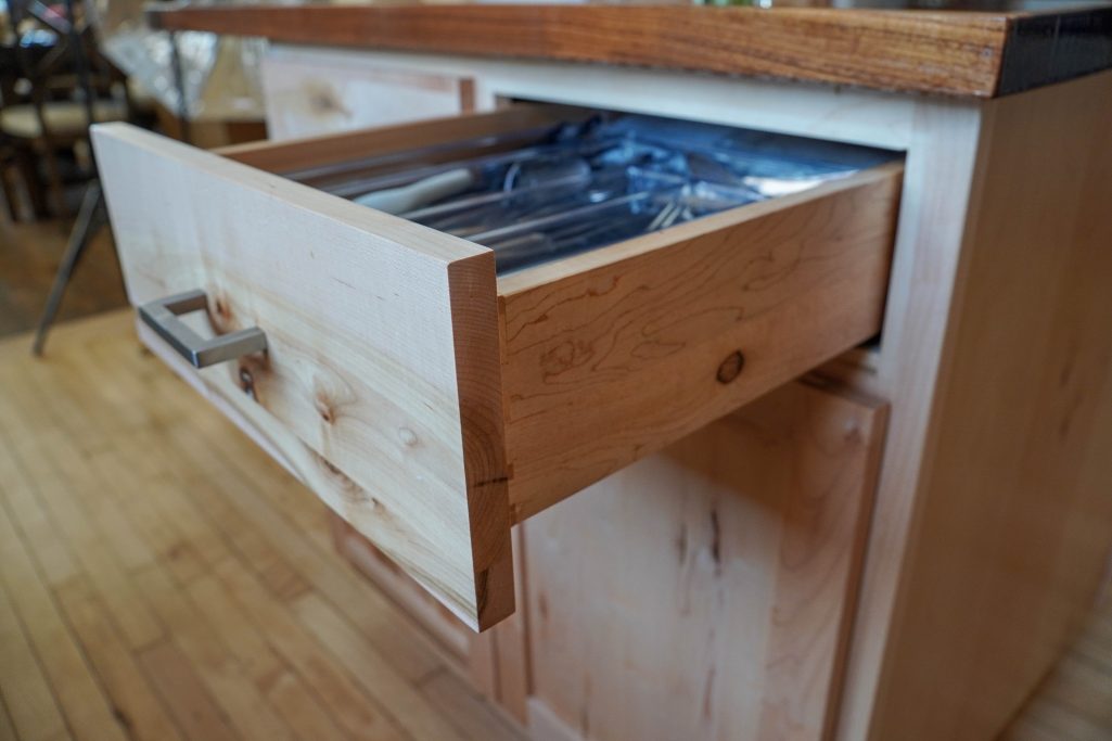 Soft close hardwood drawers for silverware.