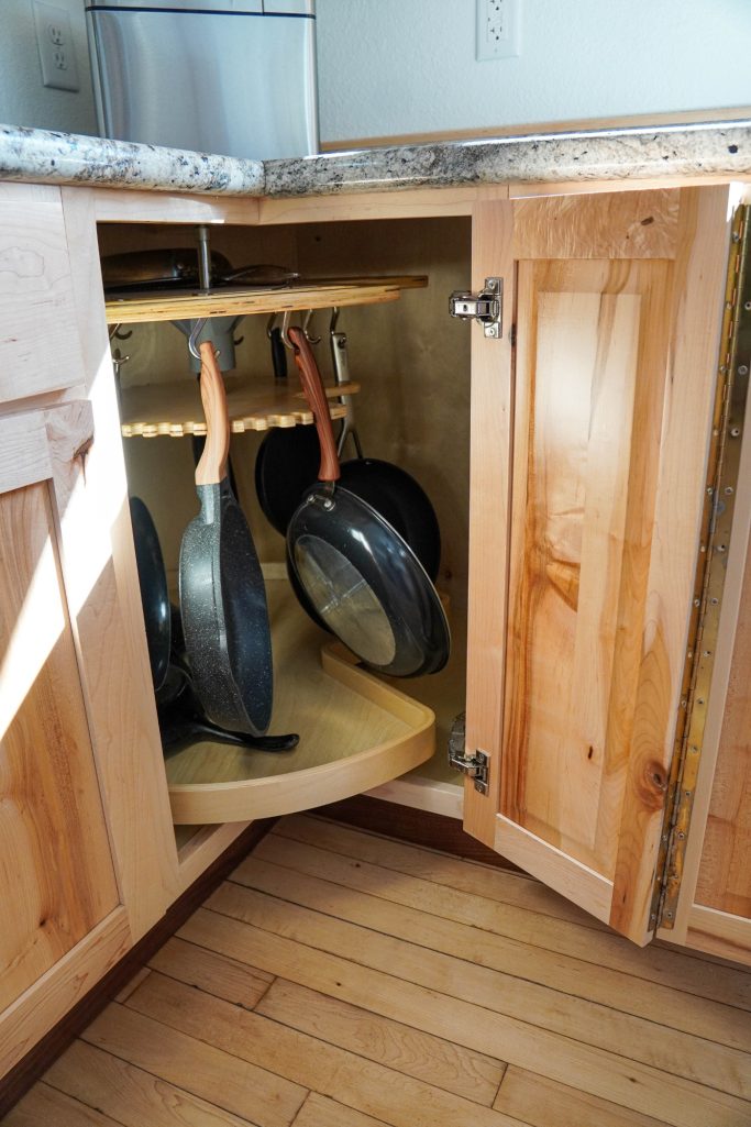 Two tier Lazy Susan corner cabinet custom tailored to fit this rustic maple wood kitchen.