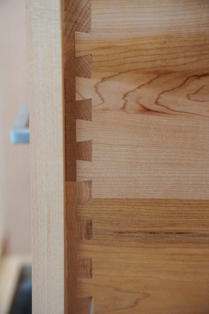 Handcrafted dovetail drawers in Maple hardwood kitchen.