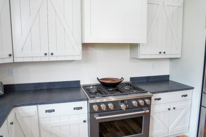 Image of Amish crafted range hood and maple wood cabinets.