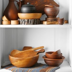 Tiered storage shelves with wooden bowls and custom features.